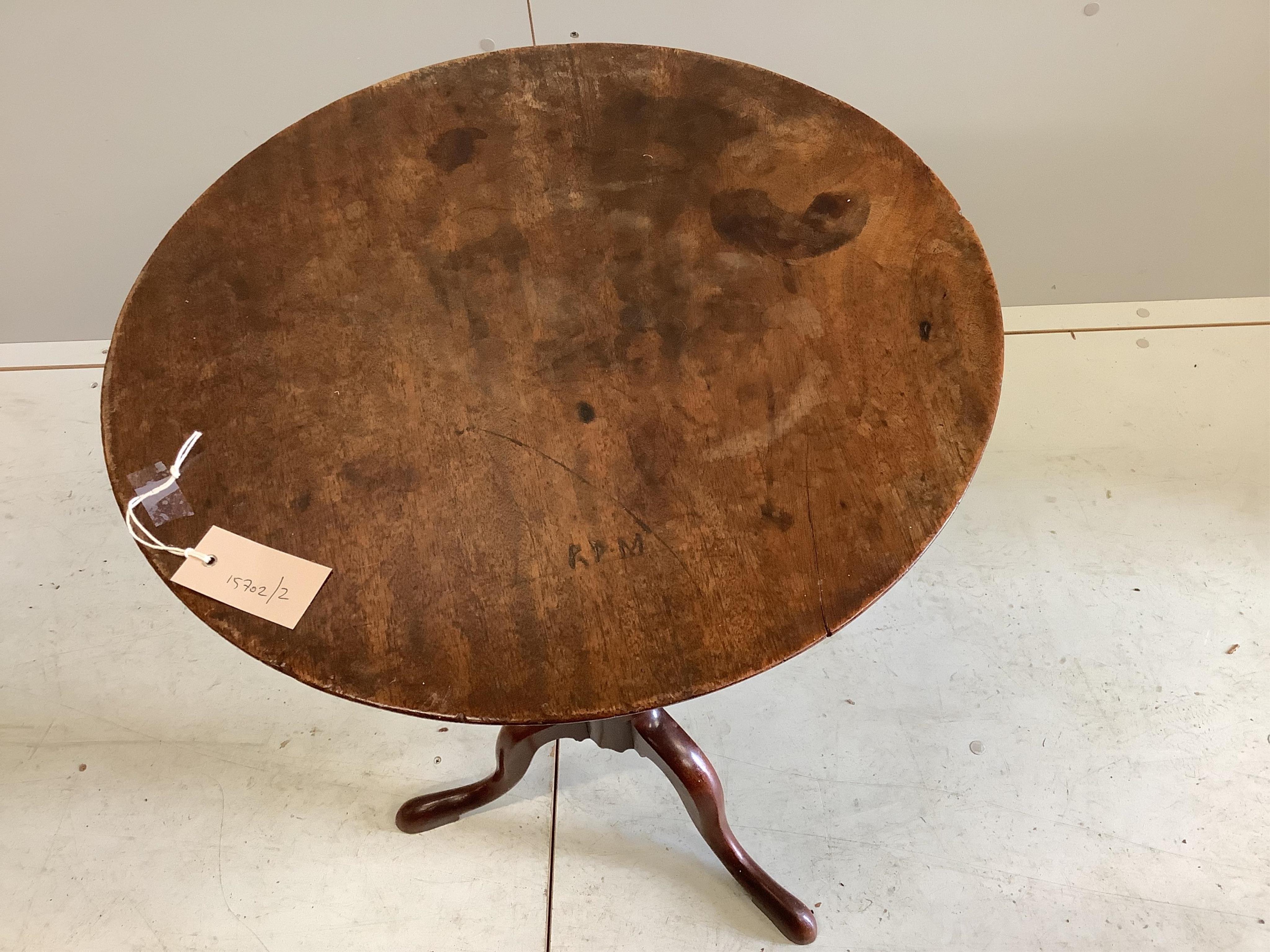 An early Victorian mahogany tilt top tripod wine table, diameter 51cm, height 71cm. Condition - fair